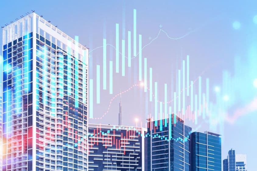 Bâtiments avec le Burj Khalifa en arrière-plan et des graphiques devant.