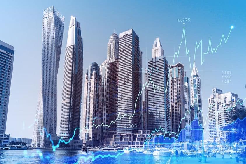 Centre d'affaires de Dubaï avec graphique forex superposé.